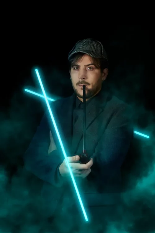 a man holding a pipe with blue lights